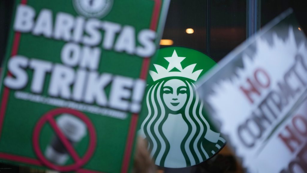 Starbucks workers kick off 65-store US strike on company’s busy Red Cup Day