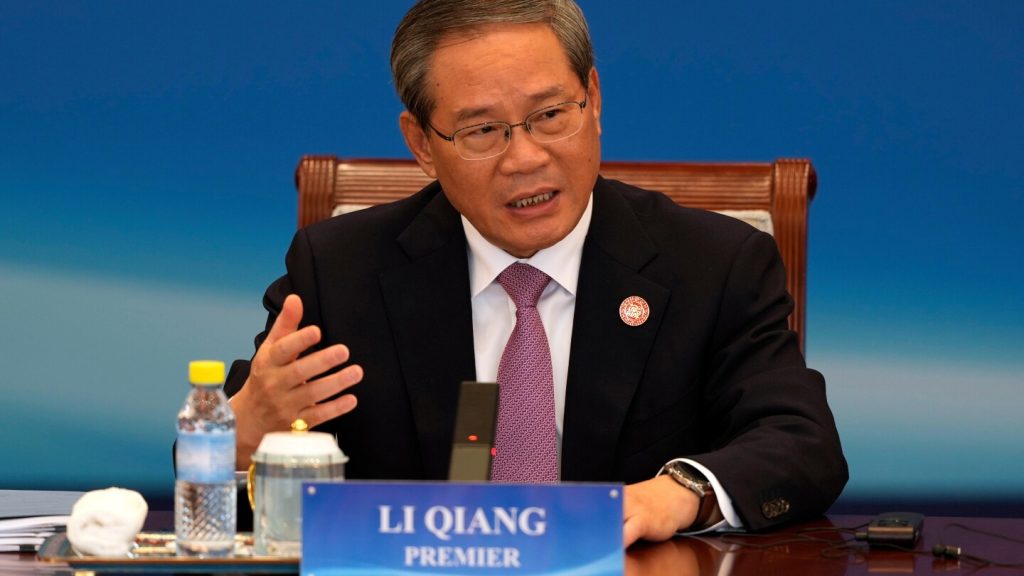 Chinese premier cites damage from US tariffs, as China’s surplus surpasses $1 trillion