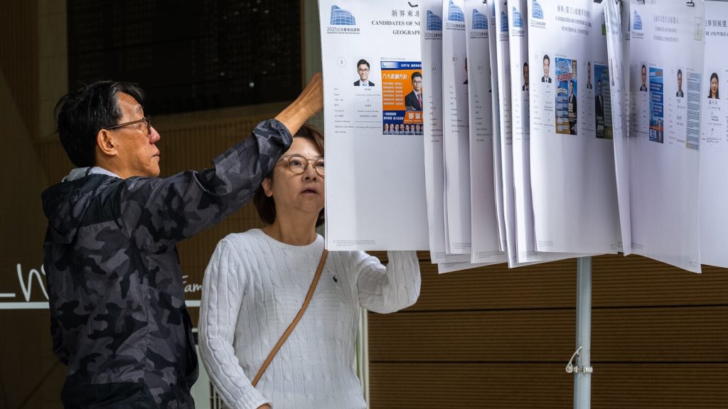 Hong Kong voter turnout rate edges up despite public anger over deadly fire