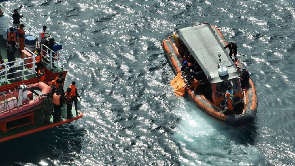 Indonesian rescuers find a second body as search for Spanish soccer coach and 2 children extended
