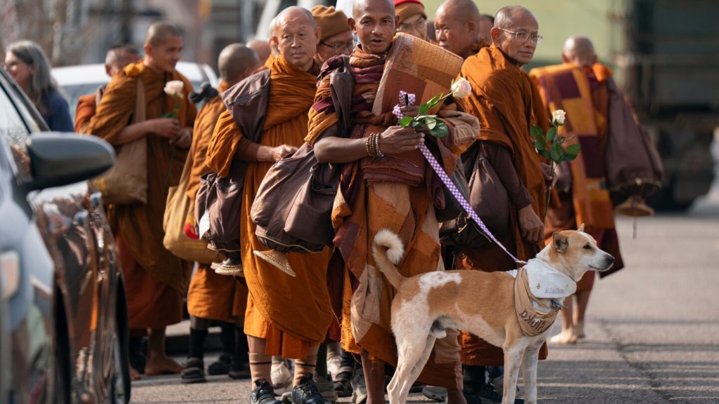 Buddhist monks and their dog captivate Americans while walking for peace