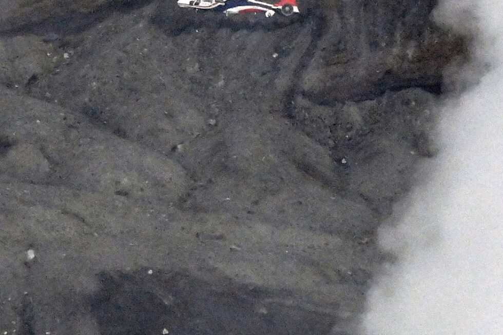 Rescuers spot wreckage possibly from a helicopter that went missing near a volcano in Japan