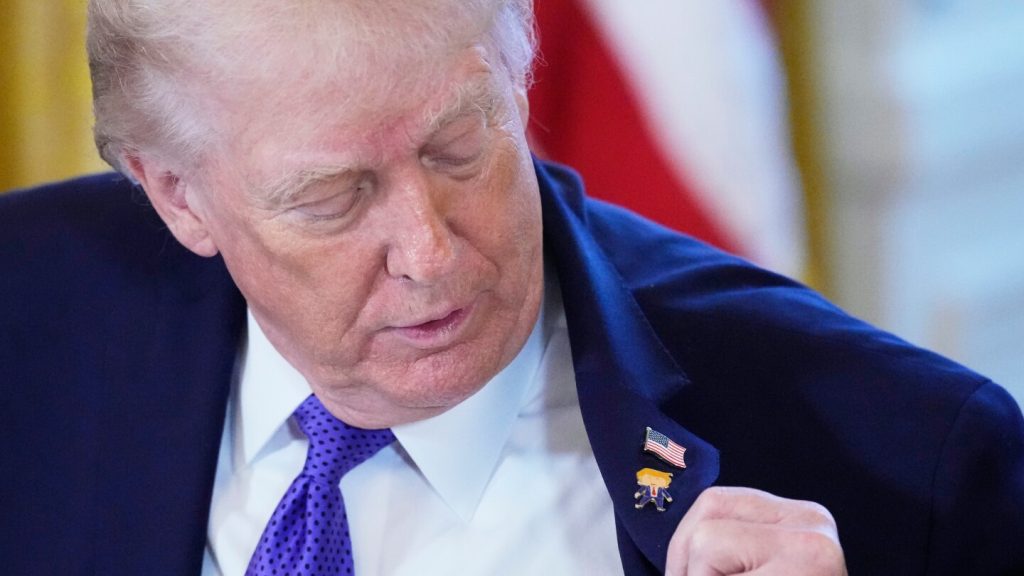 Trump wears a new ‘Happy Trump’ lapel pin, but insists he’s never happy