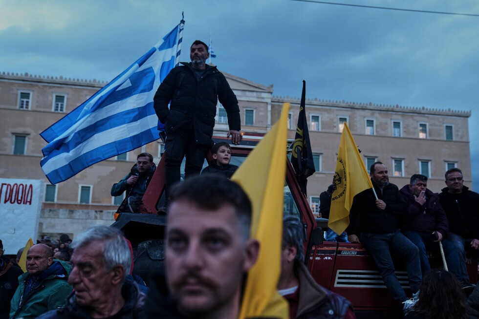 Angry Greek farmers converge on parliament with tractors in overnight protest rally