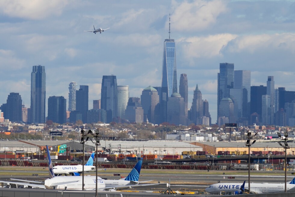 A burning smell forces Newark airport control tower evacuation, briefly halting flights